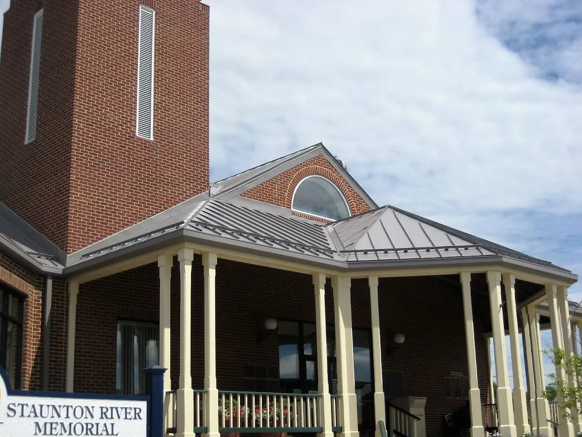 Skilled roofing craftsmen working on a residential roof in Mount Morris